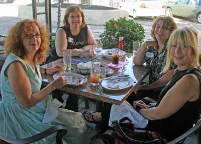 Front - Anthea Metzger and Ginny Tomaro (Full Circle Salon). Back - Stacy Dudevszky, owner, Western Reserve Harley-Davidson, Debbie Carney, owner, New Order Organizers