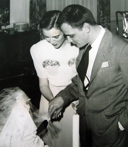 Robert and Ann Halle Little cut the cake at their wedding