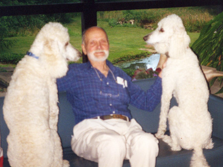 Robert Little surrounded by canine family members