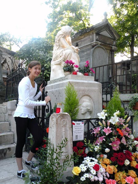 Arianna Koritn at Père Lachaise Cemetery in Paris next to Chopin's grave