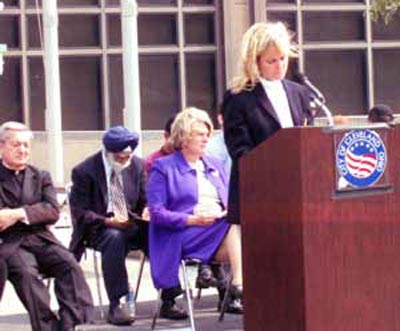 Cathy Horton Panzica speaking with Bishop Pilla, Mayor Jane Campbell and others