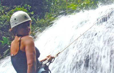 Danielle Serino rappelling down a waterfall in Santa Lucia