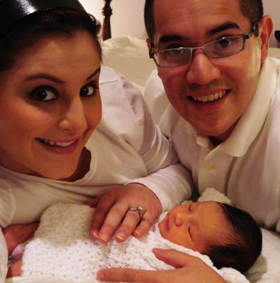 Dominique Moceanu, husband Mike Canales and new addition Carmen Noel Canales