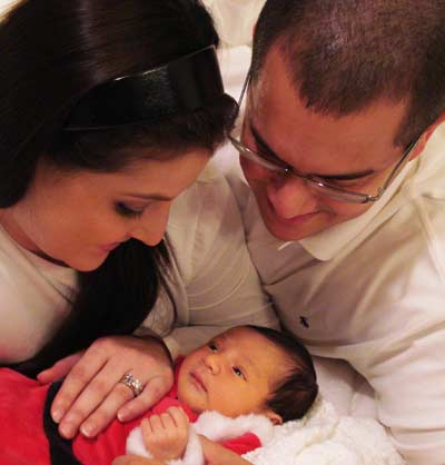 Dominique Moceanu, husband Mike Canales and new addition Carmen Noel Canales