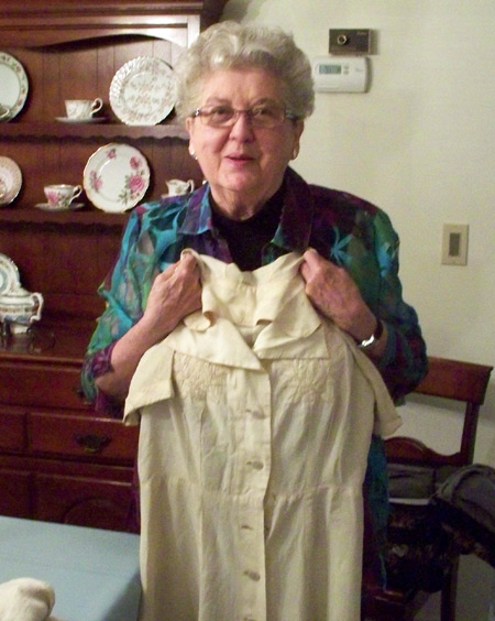 Florence Kelly Roseman with the dress she wore on the Athenia