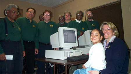 Jane Campbell with volunteers of Computers Assisting People at a new community computer lab on Kinsman