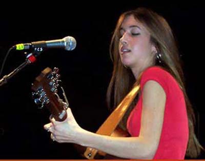 Kate Voegele playing guitar in concert