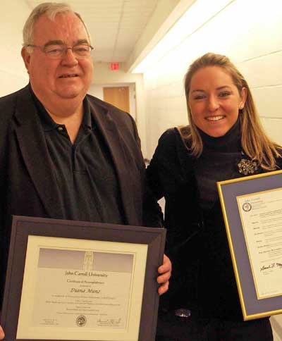 JCU President Edward Glynn presented an award to Olympic champ and JCU sudent Diana Munz - reprinted with permission from JCU web site