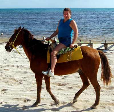 Sue Lanphear on horseback on the beach
