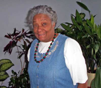 Wanda Jean Green in front of her plants