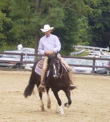 Ron Kohlhoff gives a reining demonstration on Guntown's Little Angel, a regular paint mare, owned by Terri Bayless. 