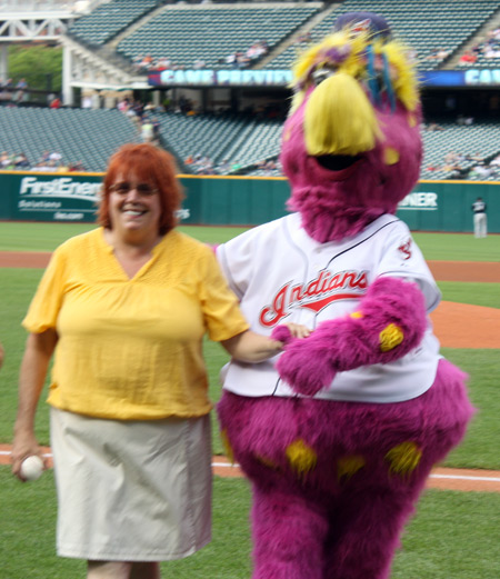 Debbie Hanson with Slider on pitchers mound at Progressive Field
