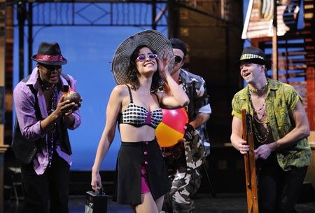 Comedy of Errors - Luciana (played by Gisela Chpe) lights up the stage as ensemble members Terrence Green (left) and Jens Lee (right) watch