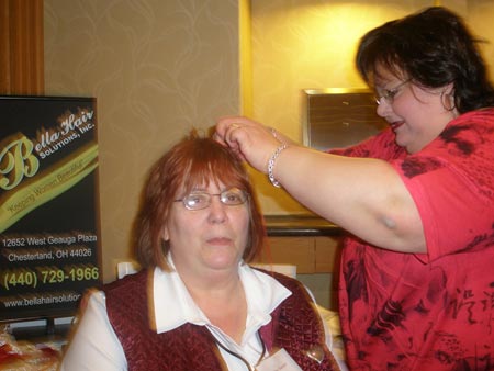 Carmela Hill adds red to Debbie Hanson's hair