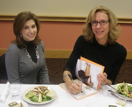 Joan Pagano signs her book