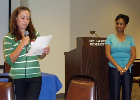 Natalie Rudd and student reading poem