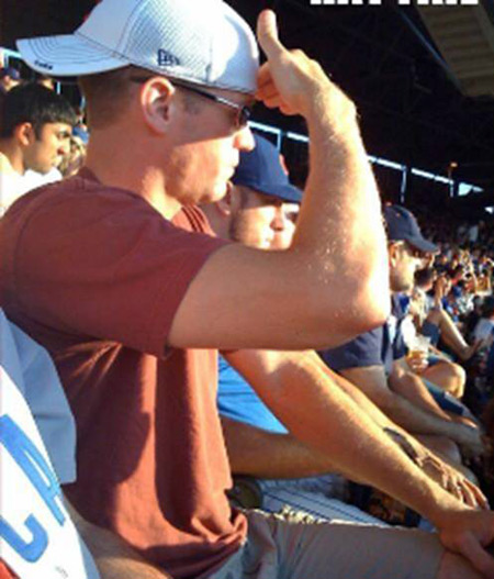 Man wearing baseball cap backwards