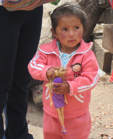 Peruvian girl with doll