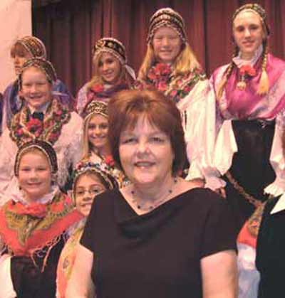 Cecilia Dolgan and children in traditional Slovenian costumes