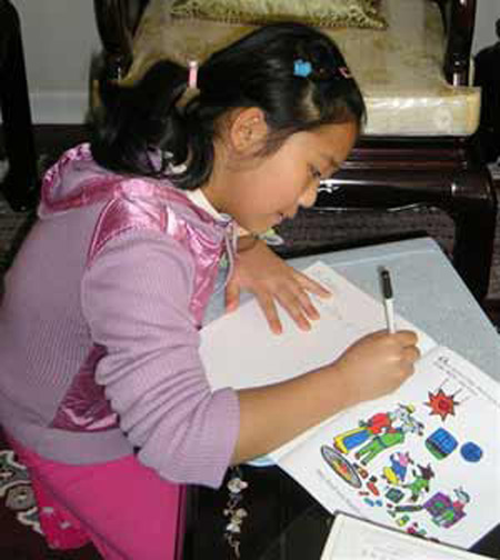 Demi Zhang signing a copy of her book