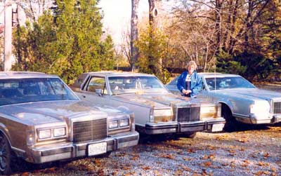 Helen Bacon with her big Cadillac cars