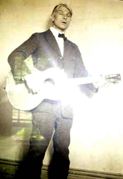 Helga's father Carl Sandburg with guitar