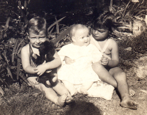 Jenny Gecsy (Brown) at age 3 in 1930 with her brother Bob, age 1, and a favorite toy