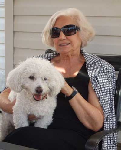 Virginia Marti with her Bichon Frise dog Sammy